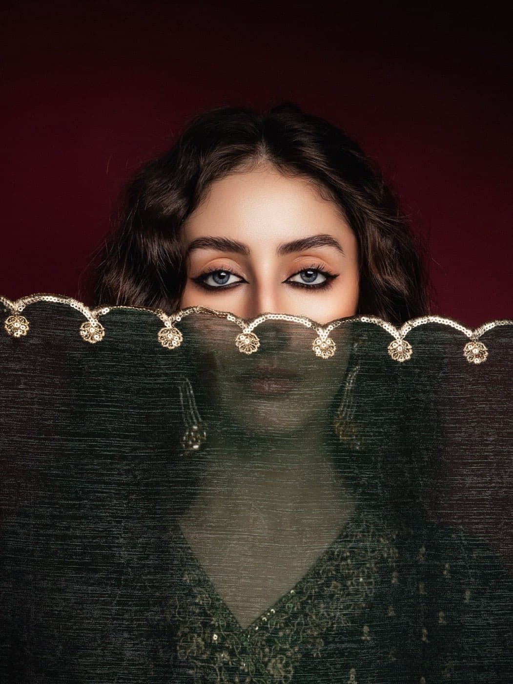 Woman in traditional attire with a veil